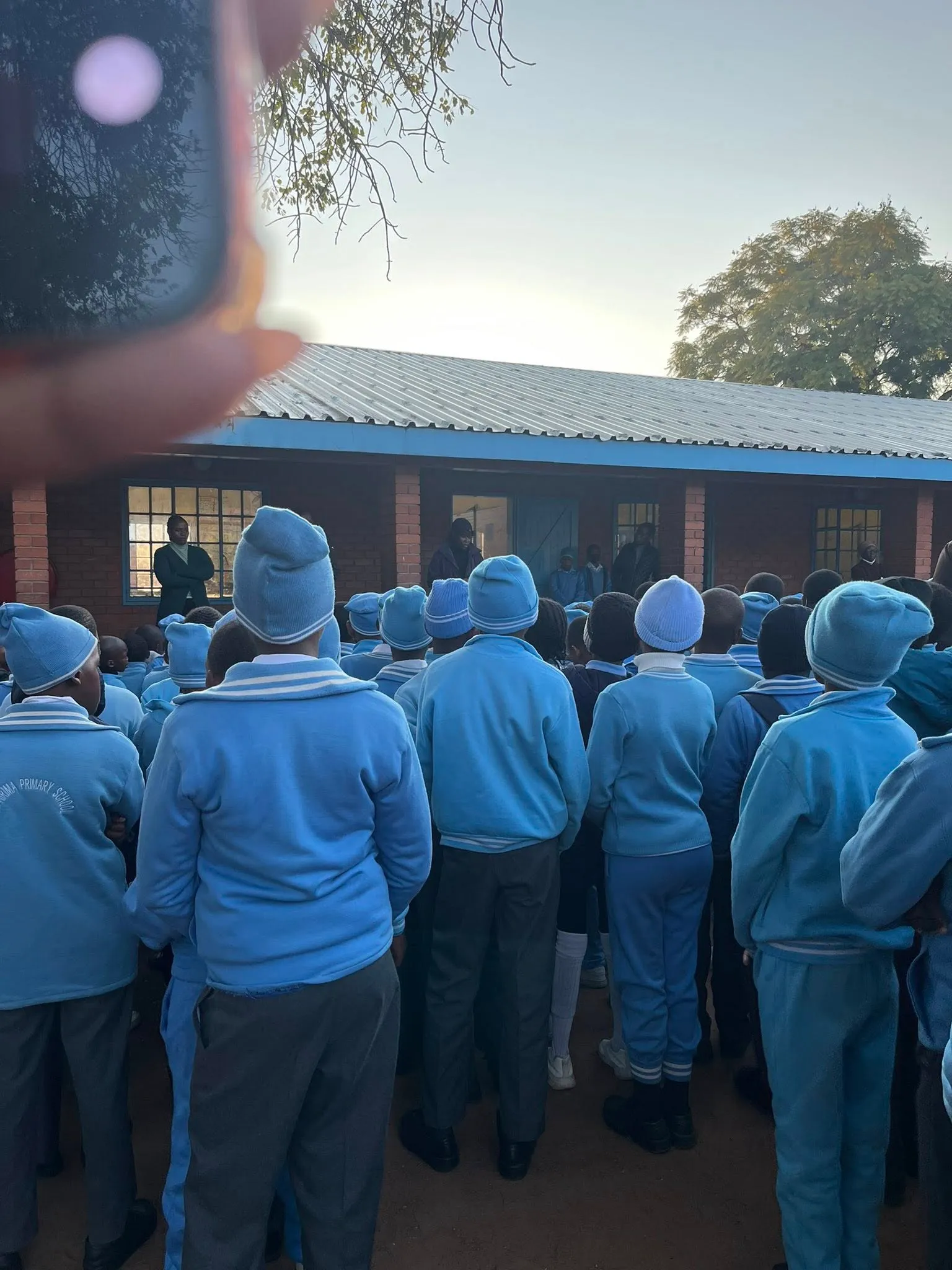 Re A Bua Founder Kemmy Mpinang donates Different but Equal at a primary school